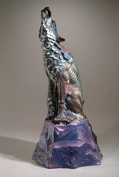 Fiberglass sculpture by Luis Jiménez titled Howl (1986). A howling coyote sits atop a purple rock.