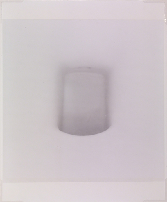 Photograph by Orit Raff called Untitled (toilet bowl) from the White series (1997). Close-up view of a toilet bowl flush passage.