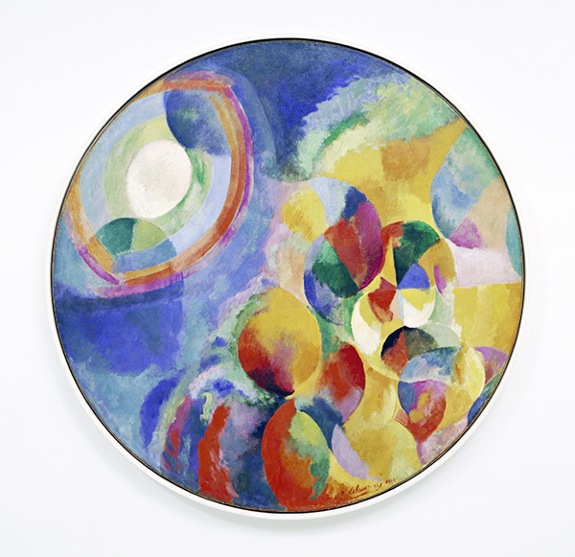 Painting by Robert Delaunay titled Simultaneous Contrasts – Sun and Moon (1913). Circular canvas with abstract circular shapes in blue, red, purple, yellow, green, and orange.