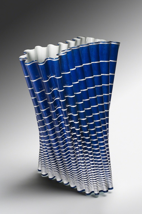 Enameled copper sculpture by Naoki Takeyama titled Yumegatari (Reverie) (2013). Undulating form with cobalt blue and white stripes on the exterior and white interior.