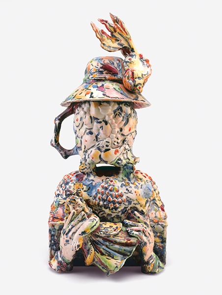 Ceramic sculpture by Viola Frey titled Pitcher of Mother (1978). Found ceramics assembled to look like the figuure of a woman holding a doll and wearing a hat.